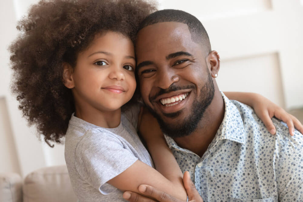 father-and-daughte-smiling-single-parent | De Ford Law Firm TX Custody Attorneys